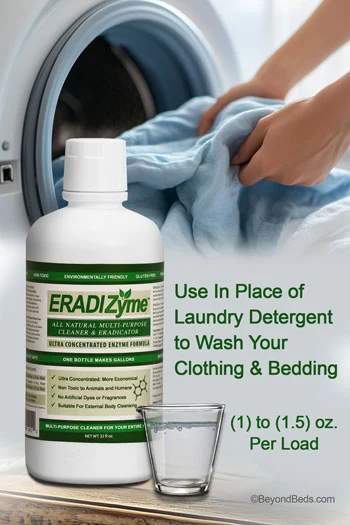 Close-up of hands pulling laundry out of a washing machine. In the foreground, there is a 32 oz bottle of Eradizyme and a 1 oz glass cup containing Eradizyme concentrate.